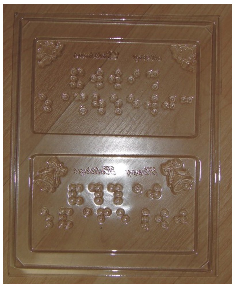 Larger Picture of our Braille Chocolate Mold: Merry Christmas and Happy Holidays