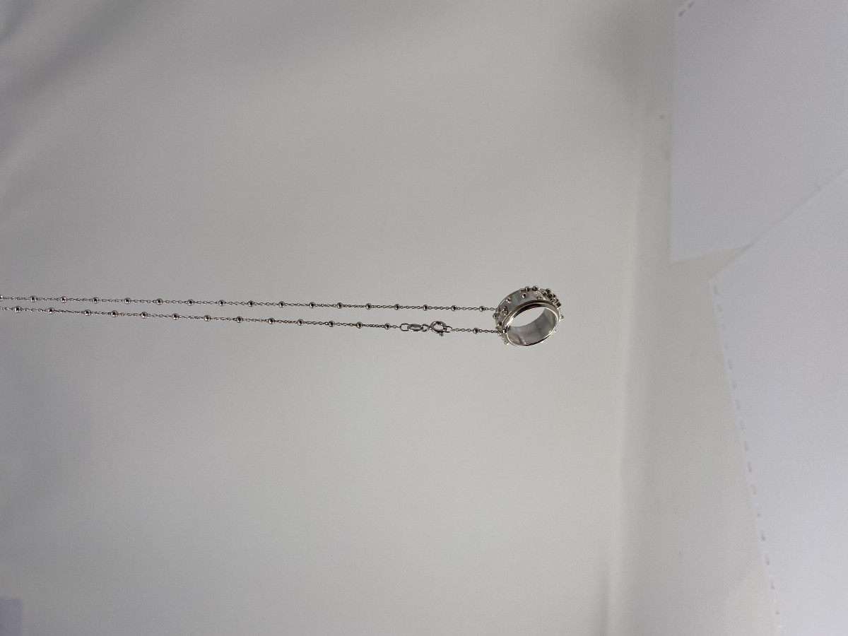 Picture picture of our Braille Fidget Spinning Necklace, Follow Your Dreams